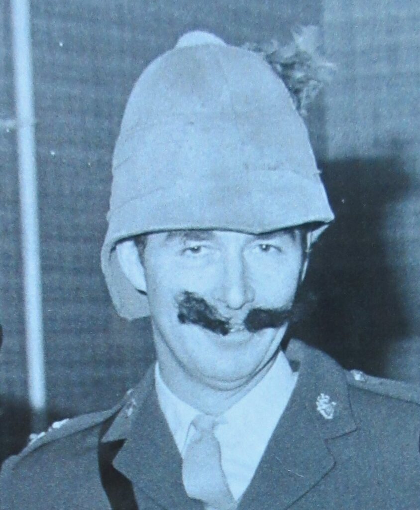 Mike in fancy dress with a pith helmet and moustache