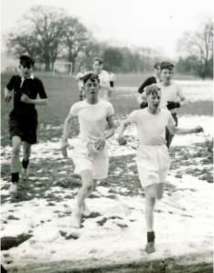 Boys running in the snow at school
