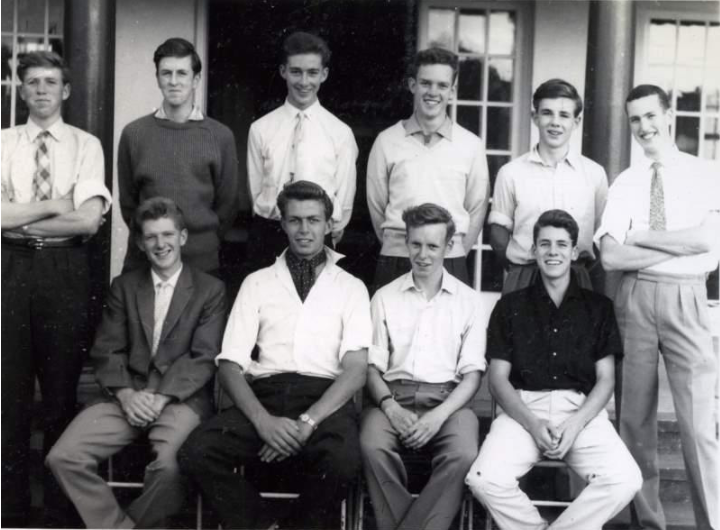 Group of schoolboys outside a school building